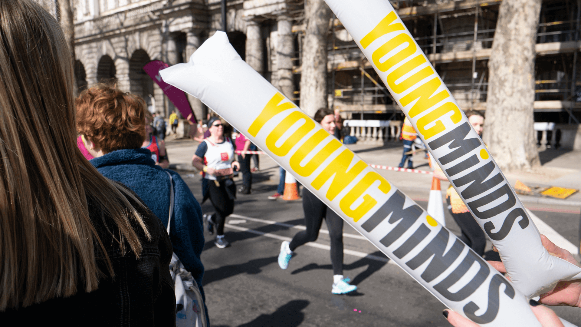 YoungMinds cheering sticks during a running event