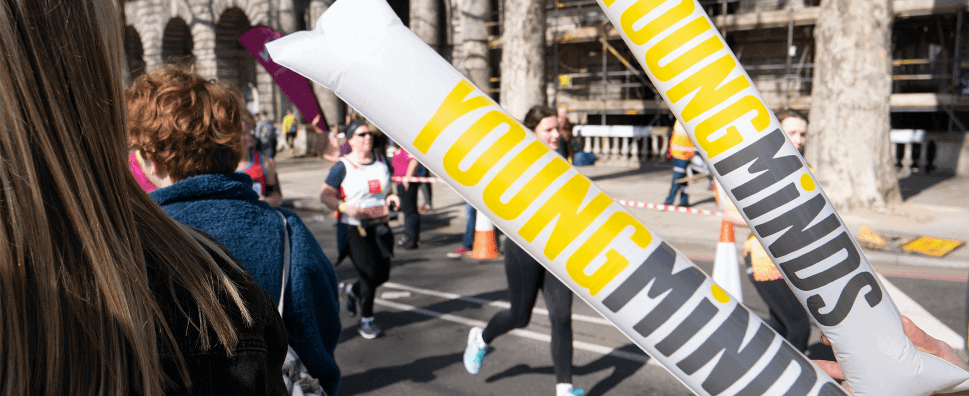 YoungMinds cheering sticks during a running event