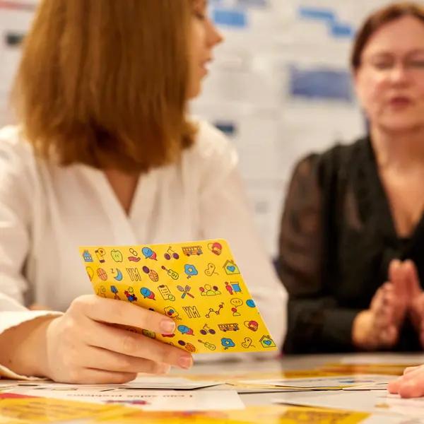 Teachers using YoungMinds resilience cards secondary pack in the classroom.