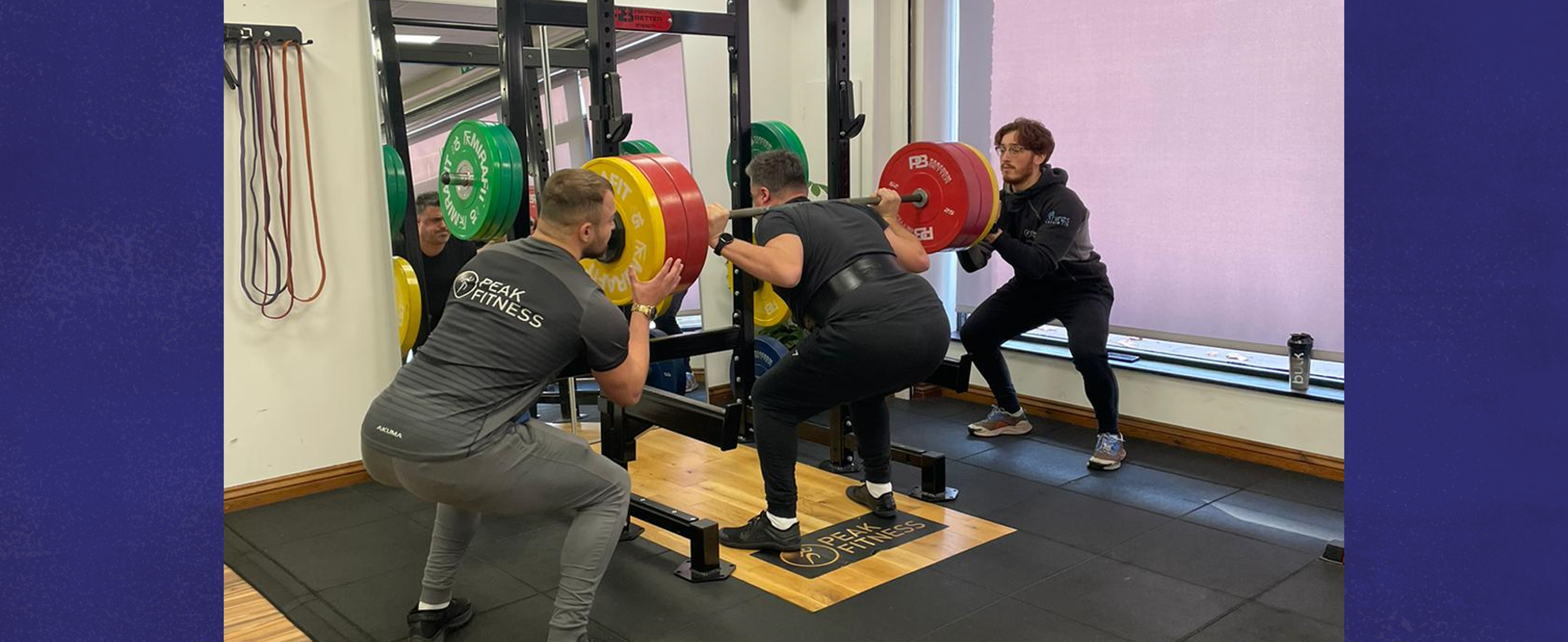 Craig lifting a heavyweight at the gym.